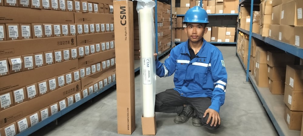Industrial operator inspecting an RO system